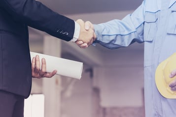 architect shaking hands with businessman