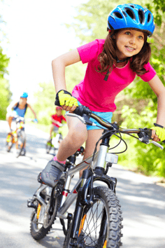 girl riding bike in homeowners association resized 600
