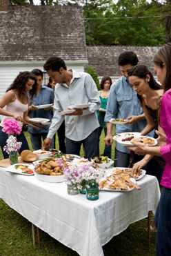 group_of_people_at_outdoor_potluck