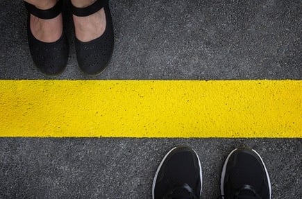 legs of two people standing opposite each other